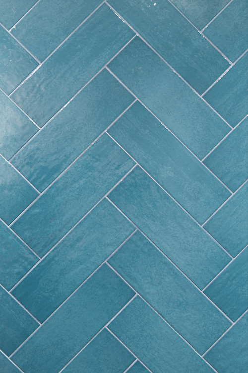 blue tiles herringbone pattern on wall