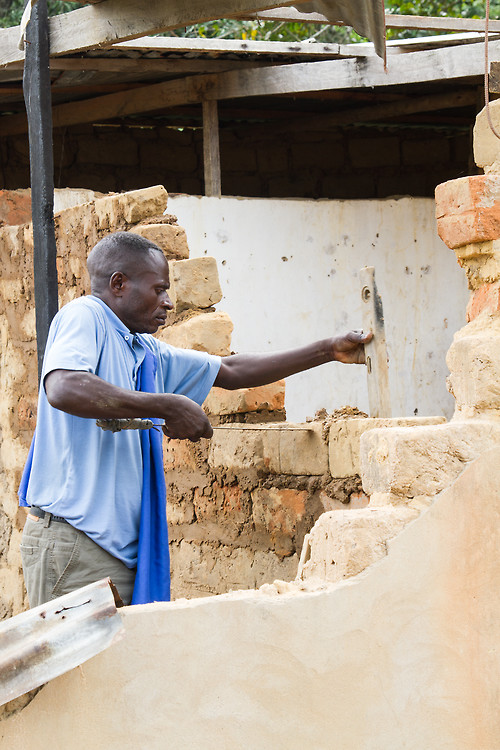 Congo Brazzaville Pool man rebuilds his house in adobe